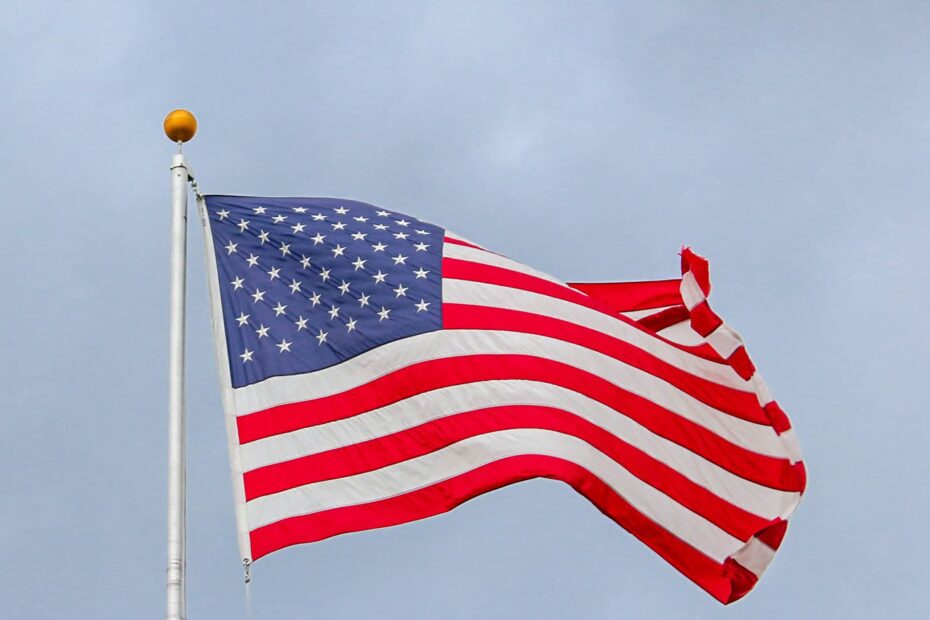 Usa Flag Waving On White Metal Pole